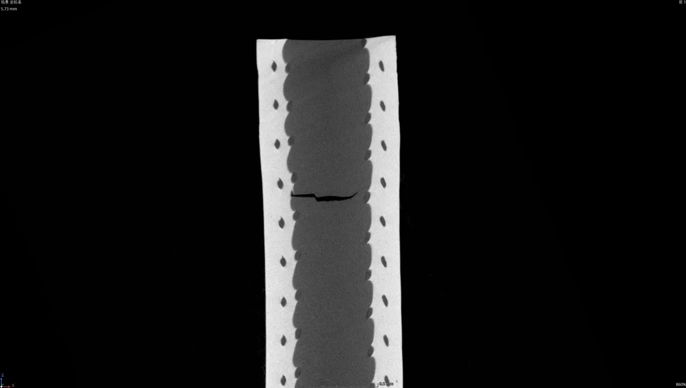 CT slice of a tube wall showing a crack