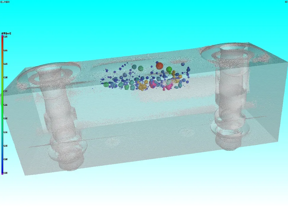 CT rendering of porosity in a cast aluminium block, colour-coded by pore size