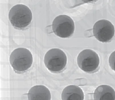 X-ray image of micro-bumps and solder balls in an advanced package, showing voids